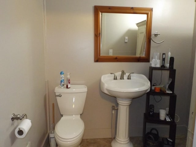 bathroom with toilet and a sink