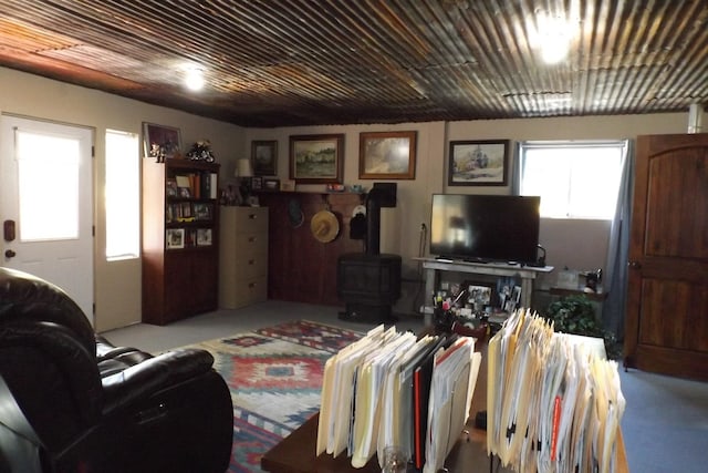 living area featuring a wood stove