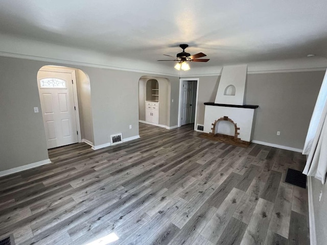 unfurnished living room with ceiling fan and hardwood / wood-style flooring