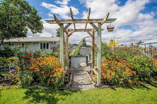 exterior space featuring a lawn and a pergola