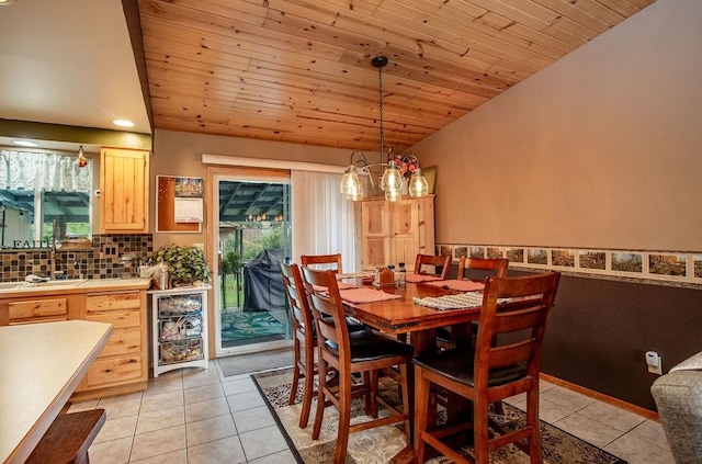 dining room with a chandelier, light tile patterned floors, beverage cooler, wooden ceiling, and vaulted ceiling