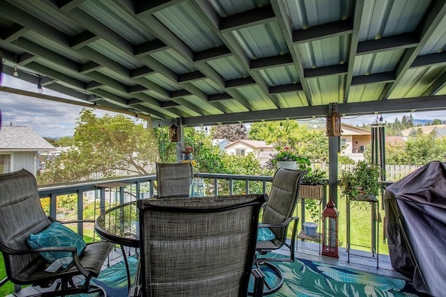 wooden terrace featuring outdoor dining space and a grill