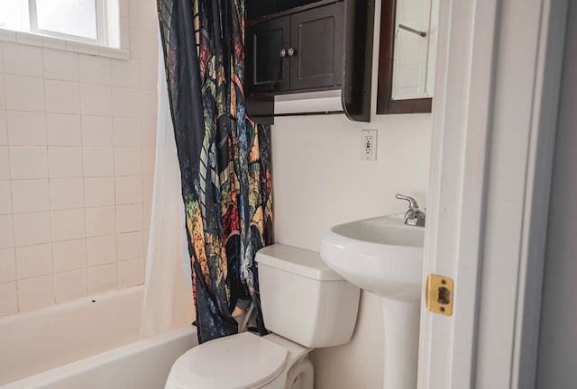 bathroom with toilet and shower / tub combo