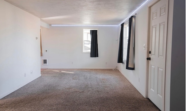 empty room featuring carpet floors