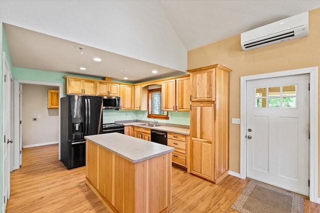 kitchen with a center island, light hardwood / wood-style flooring, lofted ceiling, black appliances, and an AC wall unit