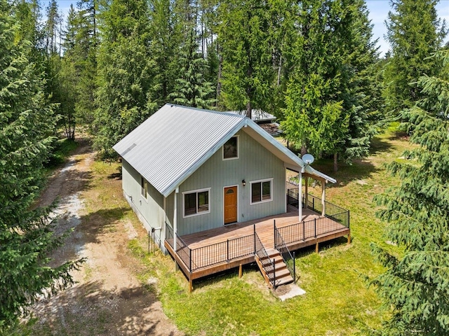 exterior space with a front lawn and a deck