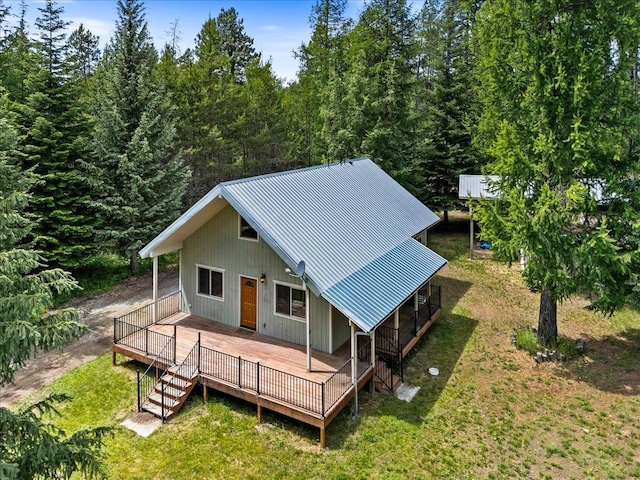 exterior space with a yard and a wooden deck