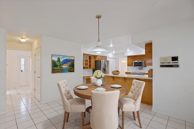 dining space featuring light tile patterned floors