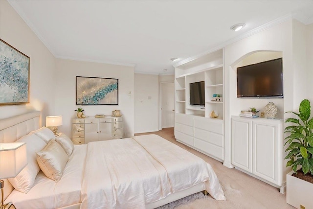 bedroom featuring ornamental molding and light carpet