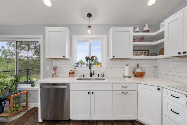 kitchen featuring white cabinets, dishwasher, and a sink