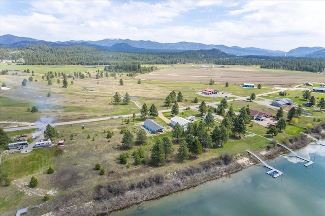 birds eye view of property with a water and mountain view and a rural view