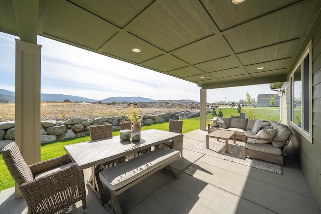 view of patio with a mountain view and an outdoor hangout area