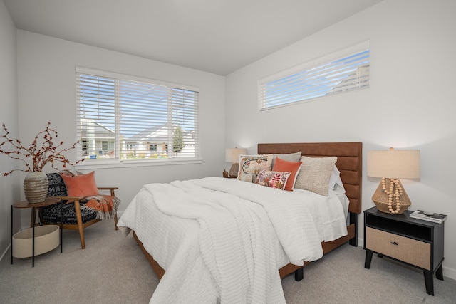 bedroom featuring light colored carpet