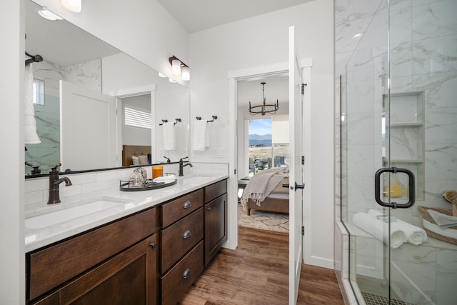 bathroom with vanity, hardwood / wood-style flooring, and walk in shower
