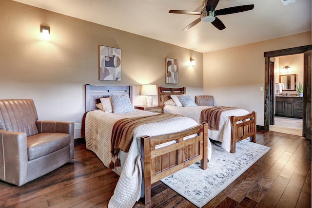 bedroom with a ceiling fan, dark wood-style flooring, baseboards, and ensuite bathroom