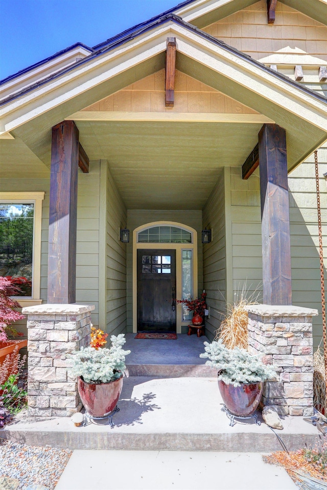 entrance to property featuring a porch