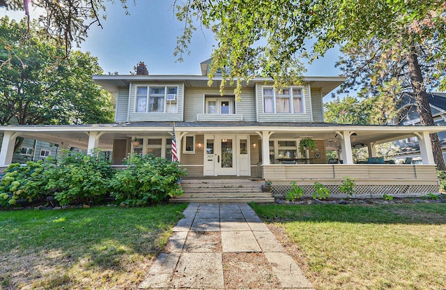 view of front of home featuring a porch and a front lawn