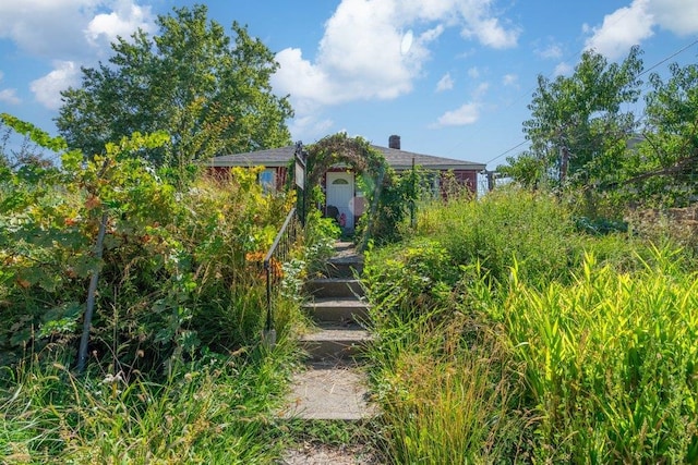 view of property hidden behind natural elements