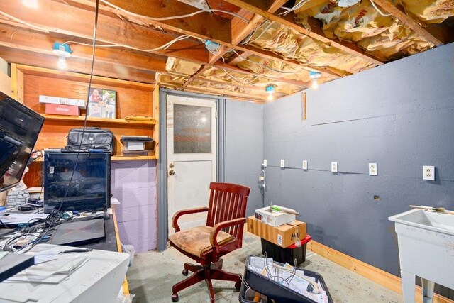 unfinished basement featuring a sink