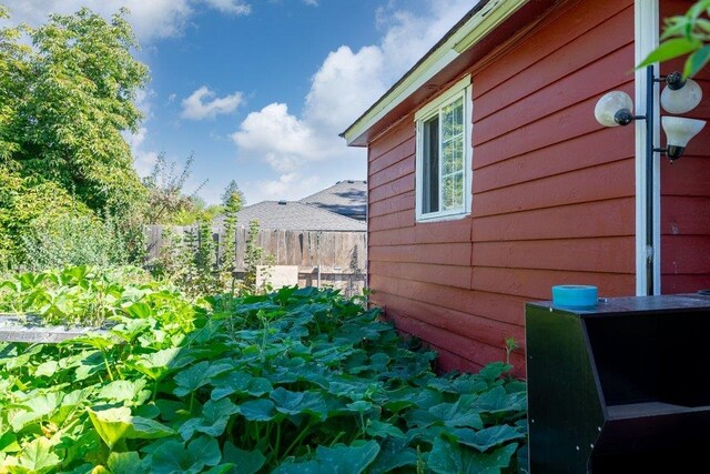 view of property exterior with fence