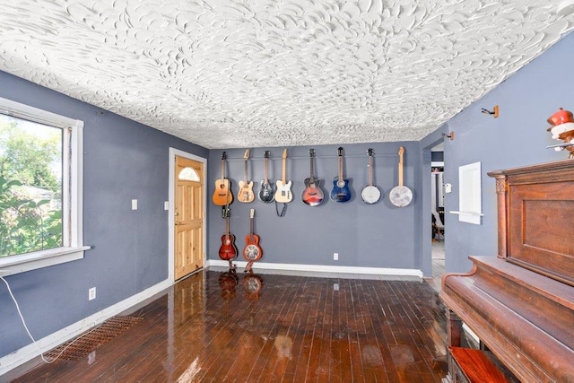 entrance foyer with wood-type flooring and baseboards