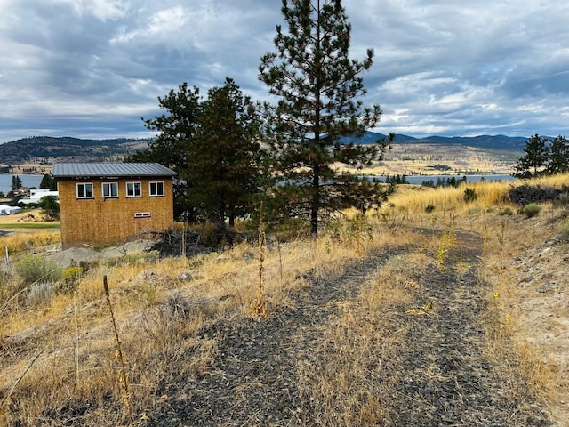 property view of mountains featuring a water view