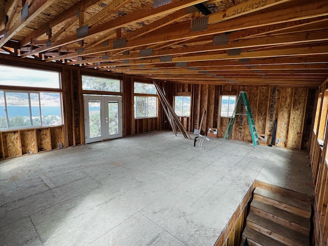 miscellaneous room with french doors and vaulted ceiling