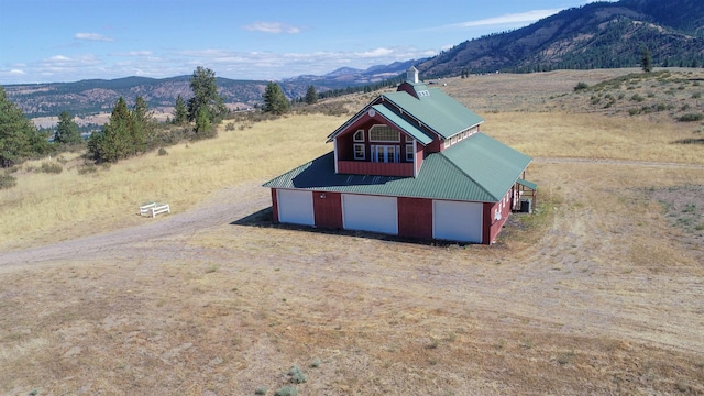 exterior space featuring a mountain view and a rural view