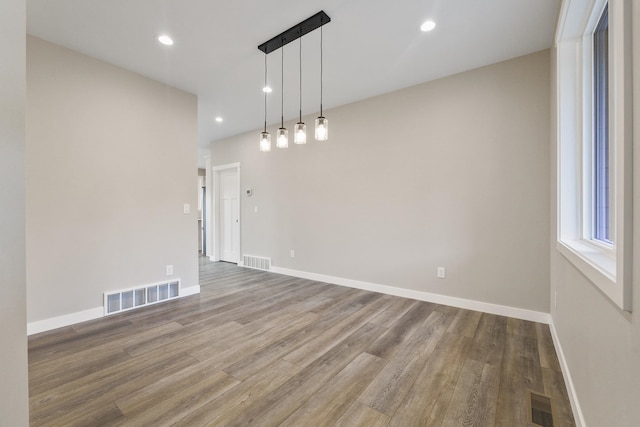 empty room with wood-type flooring