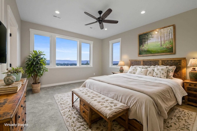 carpeted bedroom featuring ceiling fan