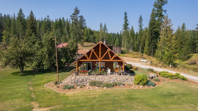 1114 Stohr Rd, Newport, WA 99156 - surrounding community with a lawn and a wooded view