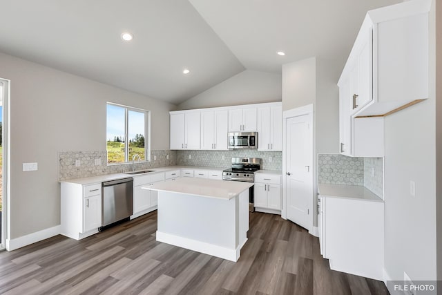 5871 S Sherri Lea Rd, Spokane, WA 99224 - kitchen featuring dark wood-style floors, decorative backsplash, stainless steel appliances, and a sink