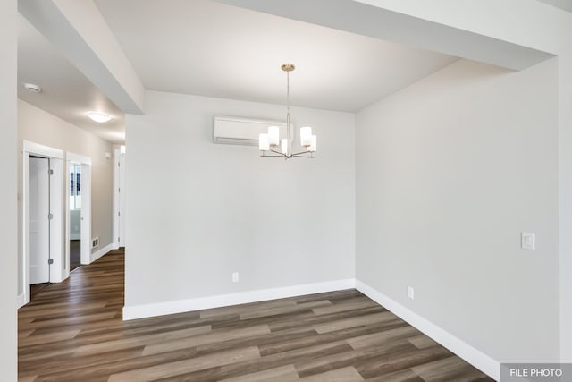 5871 S Sherri Lea Rd, Spokane, WA 99224 - unfurnished dining area featuring a wall unit AC, an inviting chandelier, baseboards, and wood finished floors