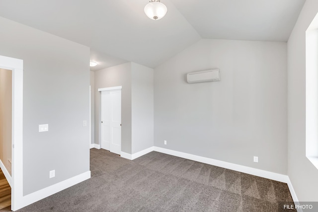 5871 S Sherri Lea Rd, Spokane, WA 99224 - empty room with dark colored carpet, baseboards, vaulted ceiling, and a wall mounted AC