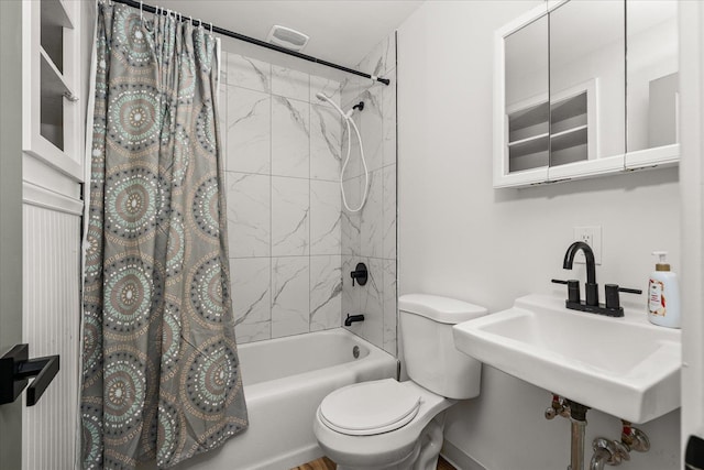 full bathroom with toilet, sink, and shower / tub combo