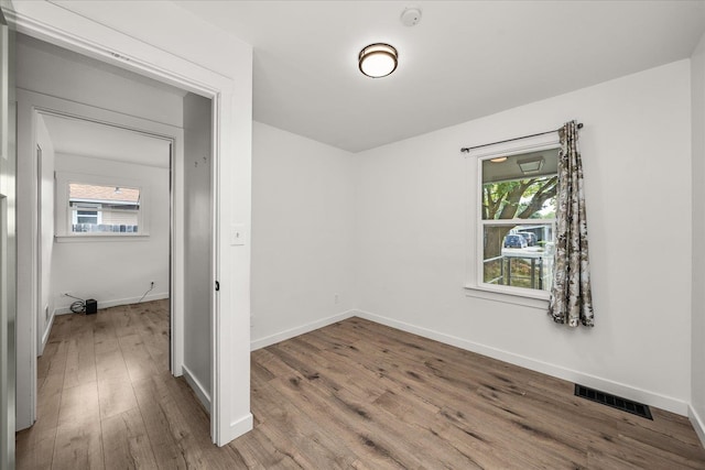 unfurnished room featuring hardwood / wood-style floors