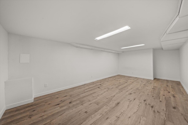 empty room with light hardwood / wood-style floors