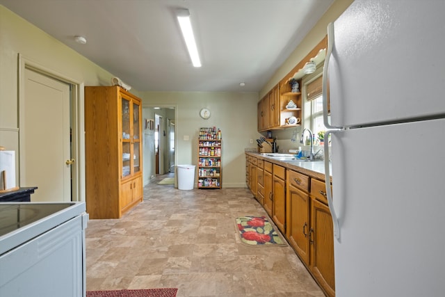 kitchen with white refrigerator and sink