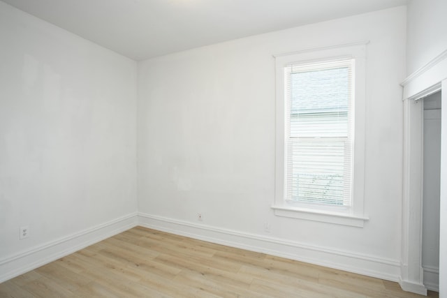 empty room featuring light hardwood / wood-style flooring and plenty of natural light