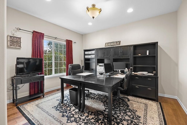 office space with light wood-type flooring