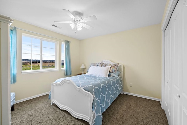 carpeted bedroom with a closet and ceiling fan