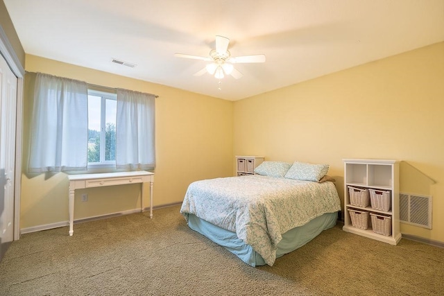 carpeted bedroom with a closet and ceiling fan