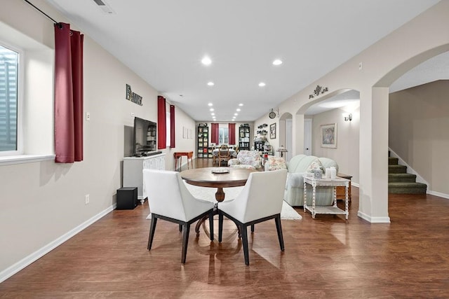 dining space featuring dark wood-type flooring