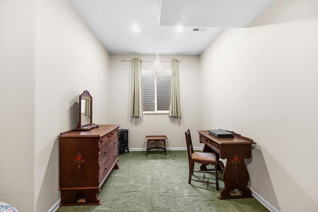 carpeted office with a chandelier