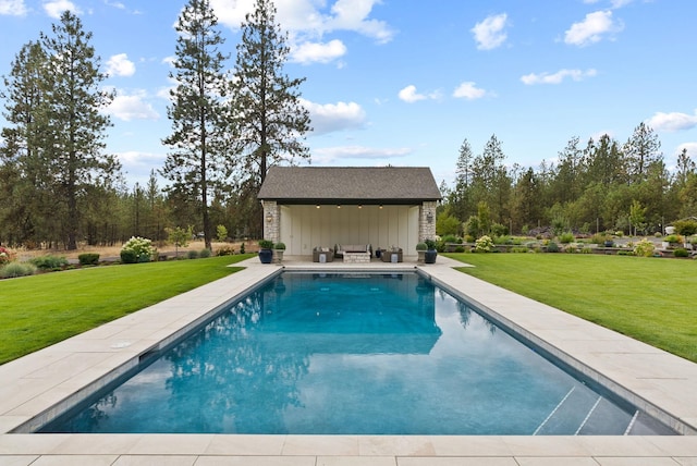 view of pool with a lawn