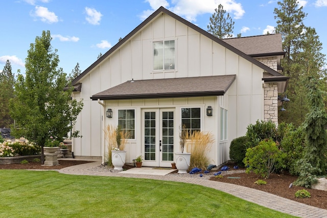 rear view of property featuring french doors and a yard