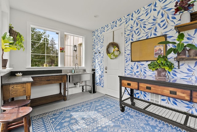 interior space featuring concrete flooring and sink