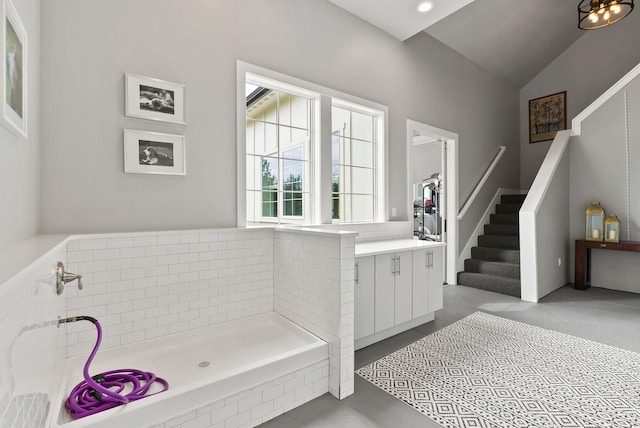 bathroom featuring lofted ceiling and vanity