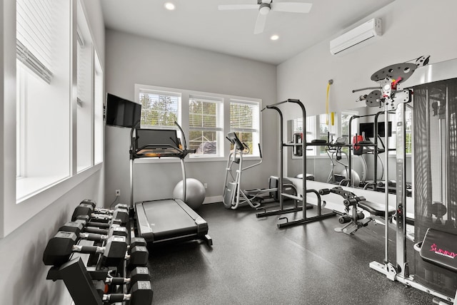 gym featuring ceiling fan and an AC wall unit