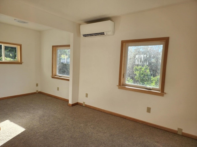 carpeted empty room with an AC wall unit and a healthy amount of sunlight